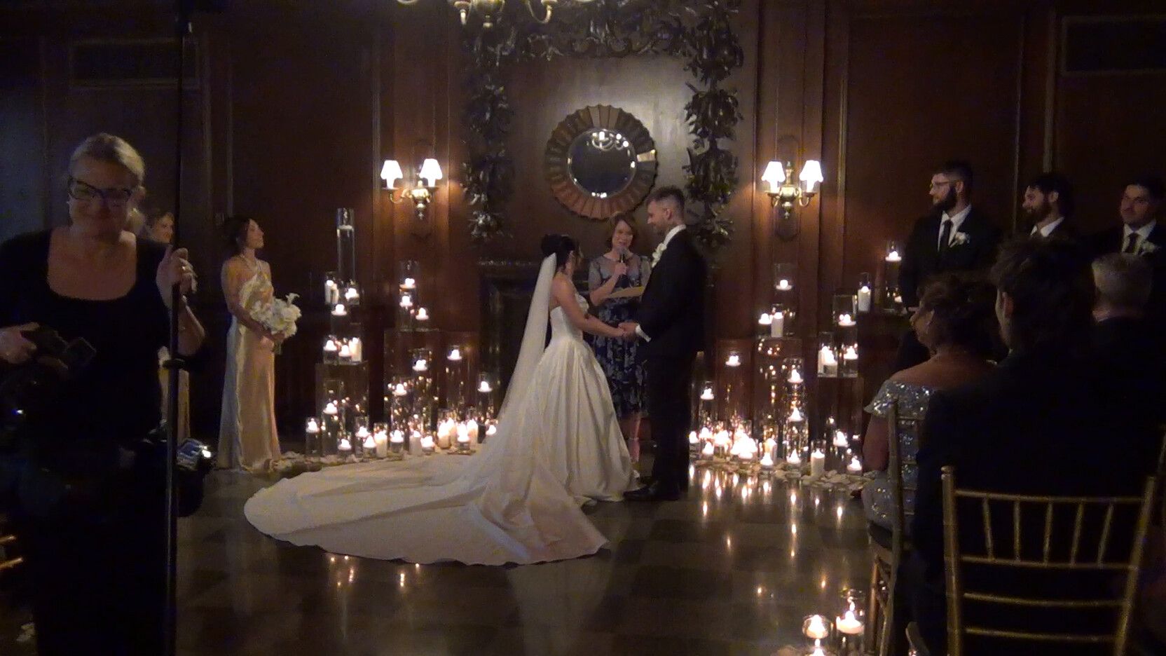 Bride entering a candlelit ballroom, filmed on a Sony Handycam camcorder rental