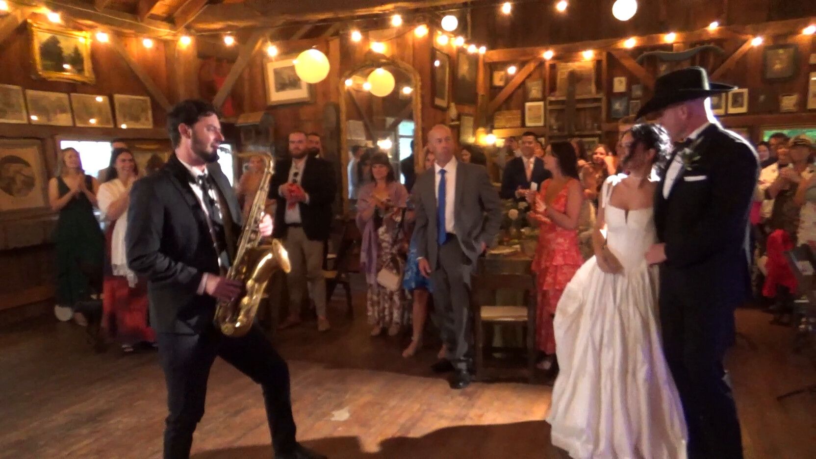 Saxophone player at a wedding reception, filmed on a Sony Handycam camcorder rental